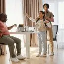 Parents Helping their Daughter to get Ready for School